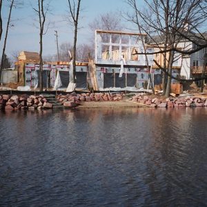 170' of Lake Oakland frontage. We used 2-4' Canadian red granite boulders. Features included a landward and waterward beach with natural grindstone steps and Metal Craft Dock.