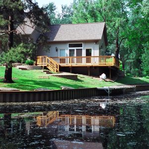 170' canal front Brown PVC seawall and flush mounted 20' dock mounted as a boardwalk.