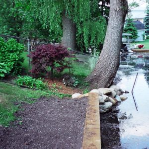 170' canal front Brown PVC seawall and flush mounted 20' dock mounted as a boardwalk.