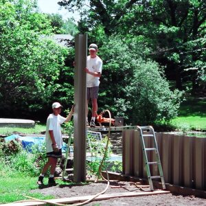 Mucky canal seawall with 10' tall PVC sheeting.