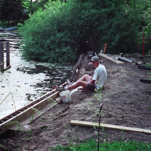 Mucky canal seawall with 10' tall PVC sheeting.