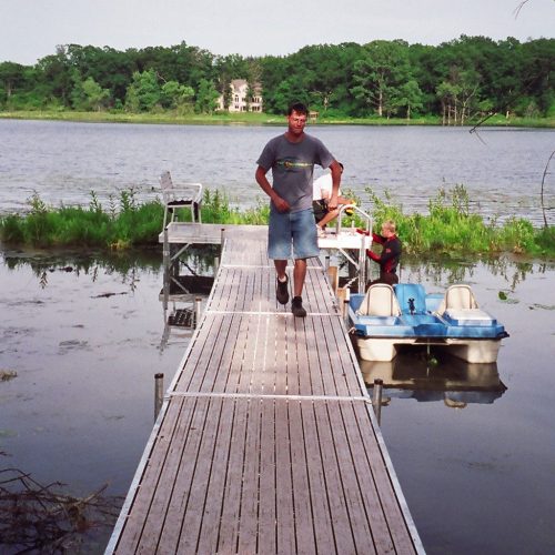 220' Metal craft dock that makes a custom Right turn with two 8X8 platforms. Accessories included stairs, bumpers cleats and custom pads for the deep muck present on this installation.