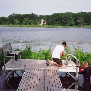 220' Metal craft dock that makes a custom Right turn with two 8X8 platforms. Accessories included stairs, bumpers cleats and custom pads for the deep muck present on this installation.