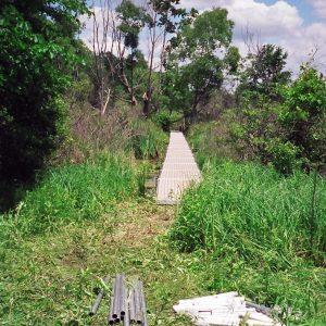 220' Metal craft dock that makes a custom Right turn with two 8X8 platforms. Accessories included stairs, bumpers cleats and custom pads for the deep muck present on this installation.