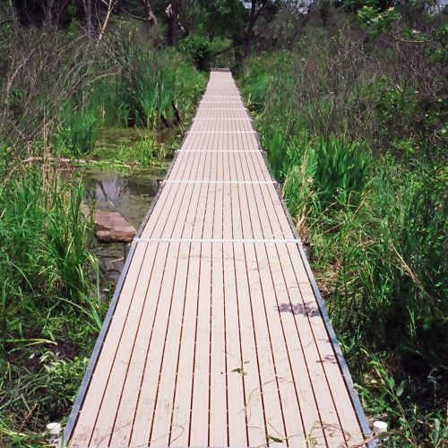 220' Metal craft dock that makes a custom Right turn with two 8X8 platforms. Accessories included stairs, bumpers cleats and custom pads for the deep muck present on this installation.