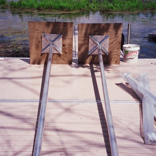 220' Metal craft dock that makes a custom Right turn with two 8X8 platforms. Accessories included stairs, bumpers cleats and custom pads for the deep muck present on this installation.