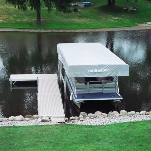Simple 3 section Metal Craft Dock with a L to the left. It extends 24' from the shore and 10' vertically parallels the shore. We also sold and installed the Midlander covered boat lift.