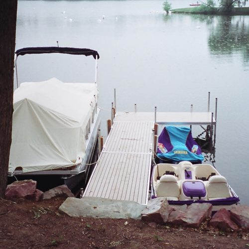 170' of Lake Oakland frontage. We used 2-4' Canadian red granite boulders. Features included a landward and waterward beach with natural grindstone steps and Metal Craft Dock.