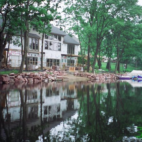 170' of Lake Oakland frontage. We used 2-4' Canadian red granite boulders. Features included a landward and waterward beach with natural grindstone steps and Metal Craft Dock.