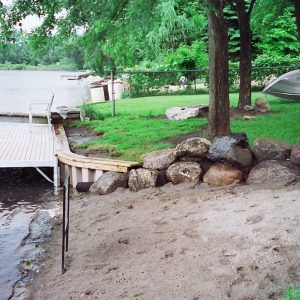 With only 50' of frontage we provided a handicapped accessible boardwalk with seating bench, landward beach and PVC seawall to stop erosion!